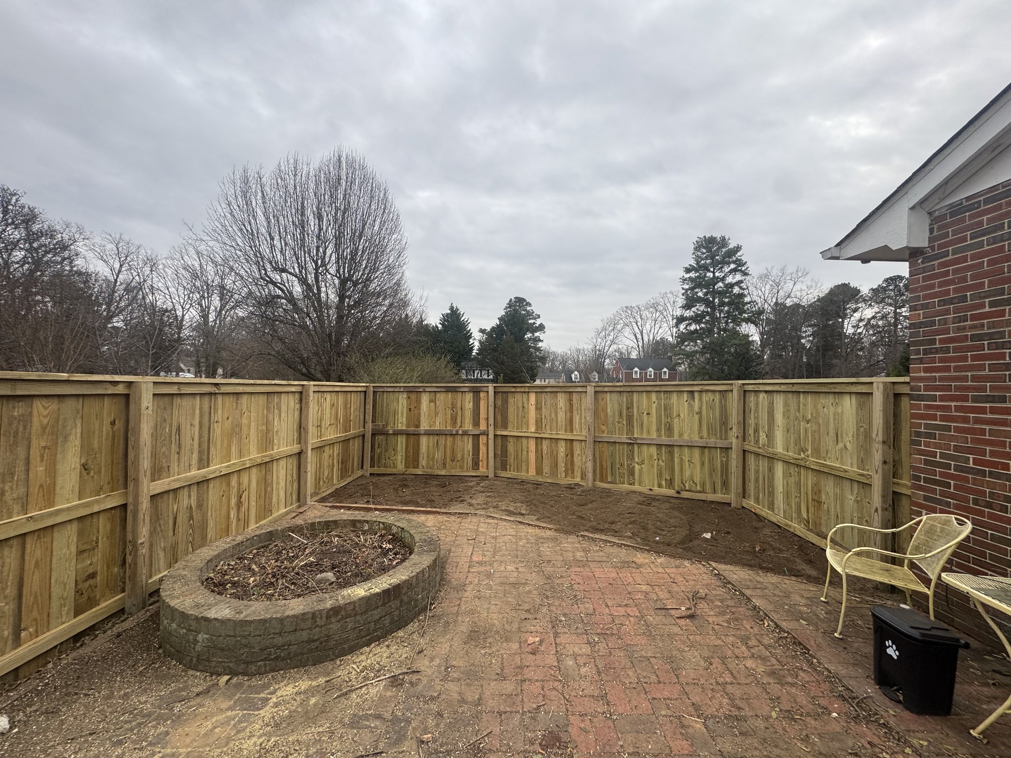 Wood privacy fence enclosing a patio